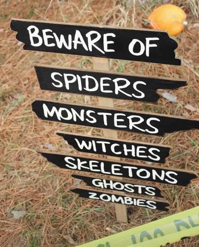 signing saying beware of spiders monsters witches